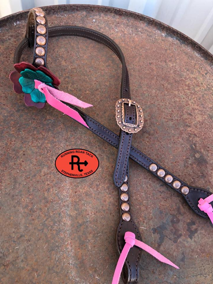 Headstall B: large burgundy flower, small teal flower, pink blood knot, copper dots and buckle, pink ties and bit ends.
