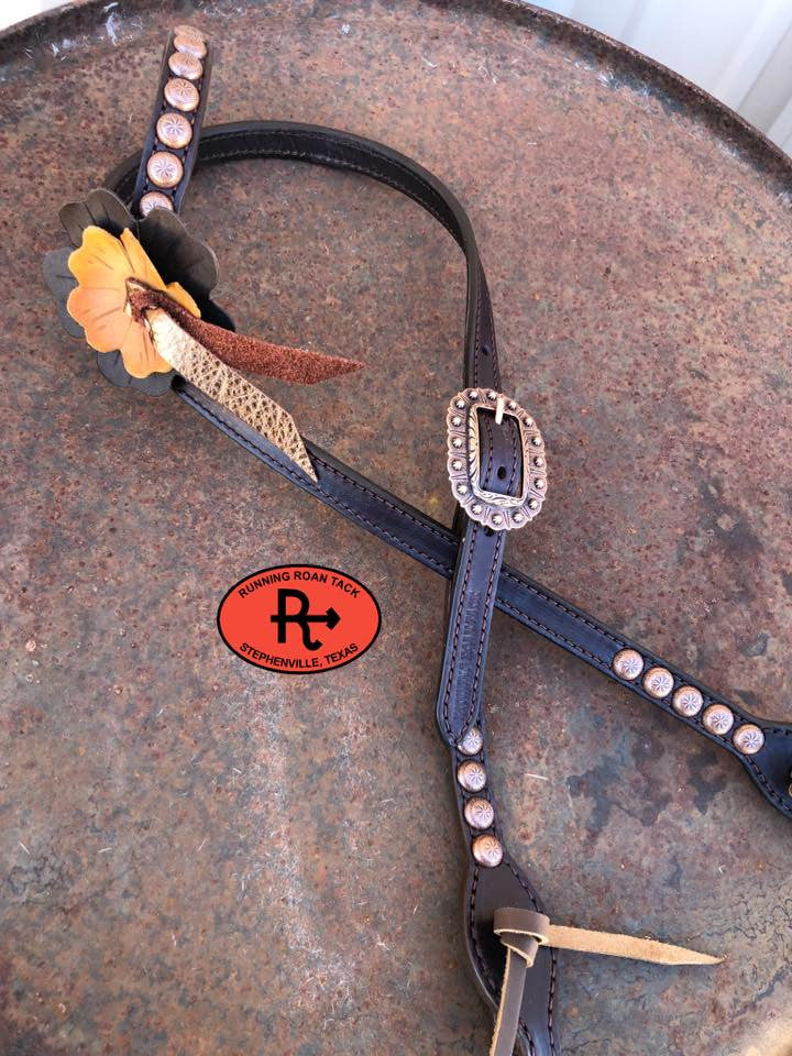 Headstall A: large chocolate flower, small buckskin flower, metallic bronze blood knot, copper dots and buckle, brown oil tan ties at bit ends.